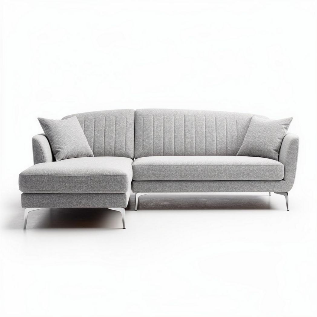 L-shaped grey fabric sectional sofa with metal legs and two throw pillows